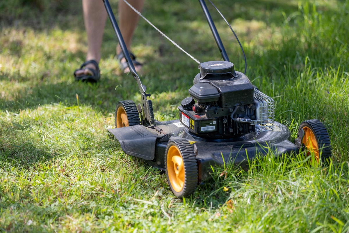 man mowing lawn